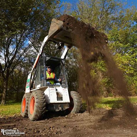 moving dirt with a skid steer|how to use a skid steer.